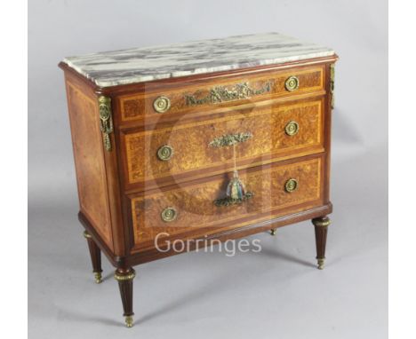 Francois Linke. A fine ormolu mounted tulipwood banded birds eye maple commode, with marble inset top and three long drawers,