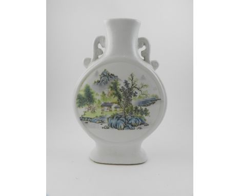 A twin-handled white glazed moon flask painted with stylised landscape to each side, H.26cm 