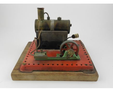 A Mamod steam engine, mounted wooden base, together with three model trains. 