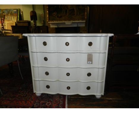 An 18th century Italian style white painted commode, fitted four long drawers, raised on bun feet. H: 85cm W: 100cm