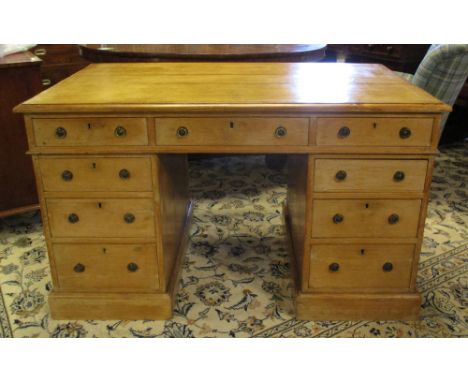 PEDESTAL DESK, Victorian pine with light tan leather top above nine drawers, 74cm H x 122cm x 75cm.