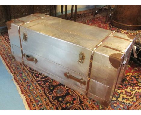 LOW TRUNK, Aviator style metal studded and leather clad with a rectangular rising top enclosing storage space over one long d