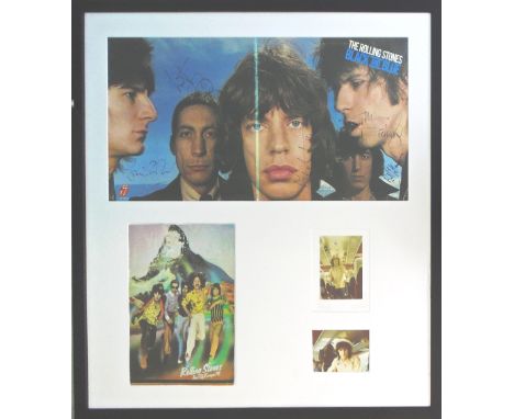 ROLLING STONES SIGNED BLACK AND BLUE LP, by The Rolling Stones plus two photos of Ronnie Wood on 1976 tour bus plus tour of E