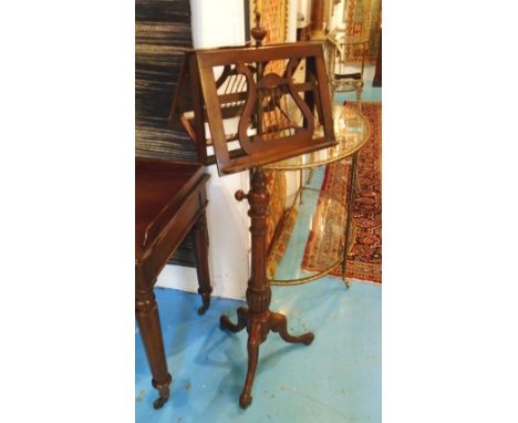 DUET STAND, Victorian walnut with height adjustable brass stem and music rests on a ratchet with tripod support, 131cm H.