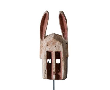 Dyommo mask belonged to the Dogon people. These masks were carved for young dancers. the hare ears symbolize the spirit of th