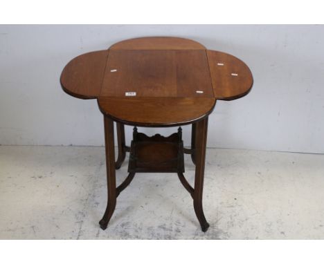 Early 20th century Oak Side Table with four drop flaps, under tier shelf and raised on four splayed legs, 45cms wide x 69cms 