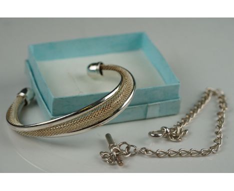 A white metal Albert chain together with a white metal bangle marked 925. 