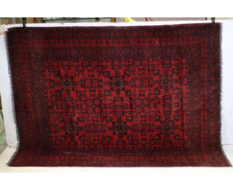 Eastern Woolen Red Ground Rug with stylised floral pattern, 200cms x 150cms 