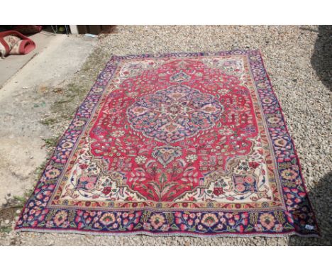 Multicoloured ground, hand woven, persian Tabraz carpet, floral medallion design, approx. 260cm x 185cm 