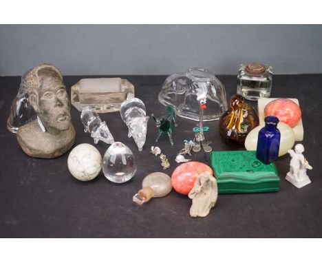 A box of mixed collectables to include a malachite paper weight, a stamp roller and a quantity of carved stone eggs. 