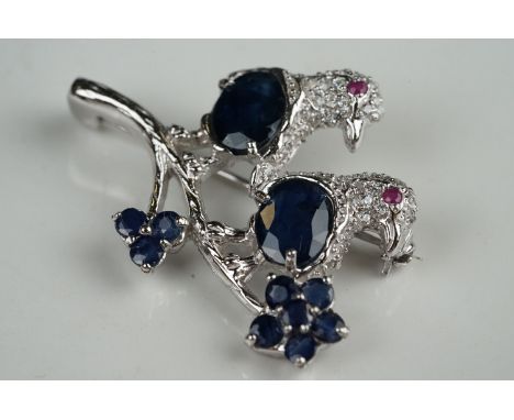 Unusual silver, CZ and sapphire bird brooch, with ruby eyes 