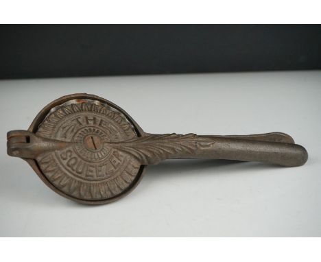 An early 20th century cast iron Lemon Squeezer with insert. 