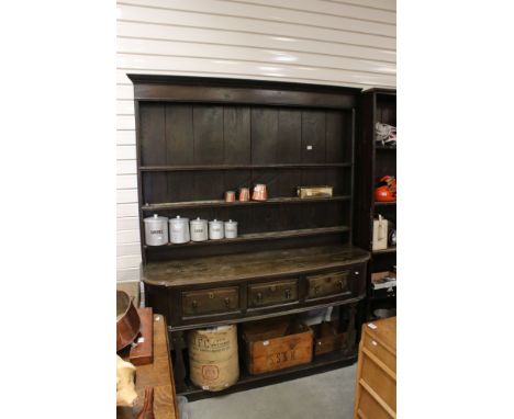 Large 17th / 18th century style Dark Oak Dresser, the rack with three shelves above a base with curved sides and three drawer