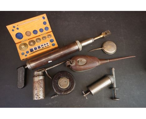 Box of vintage grease guns, oil cans, Rabone Chesterman tape measure &amp; weights