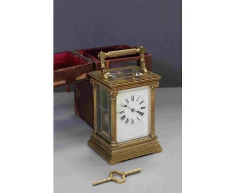 A large French brass cased repeater carriage clock with enamel dial and original travel case. 