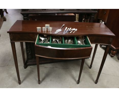 Regency style Mahogany effect Console Table with serpentine front and glass cover, the drawer holding some cutlery and napkin