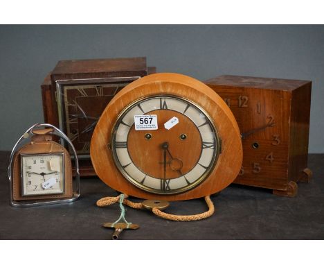 A collection of three wooden cased chiming mantle clocks together with a Smiths desk clock. 