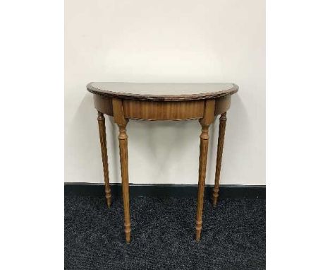 A d-shaped yew wood hall table and a Tiffany style banker's desk lamp 