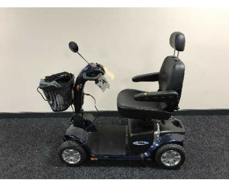 A Electro Motion Super Glide disability cart with keys, charger, manual etc