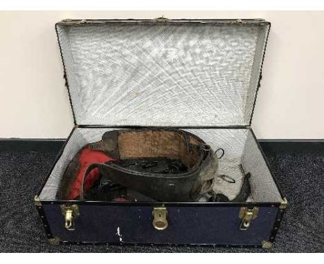 A mid 20th century trunk containing shire horse collar and tack 