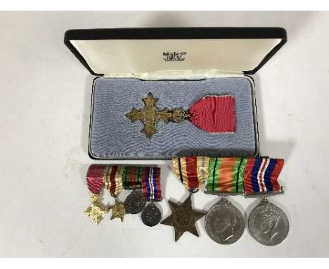 A WWII OBE medal group with ribbons, to include Africa Star, Defence Medal and War Medal and OBE, with miniatures, together w