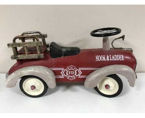 A late 19th century child's hook and ladder fire department tin plate car 
