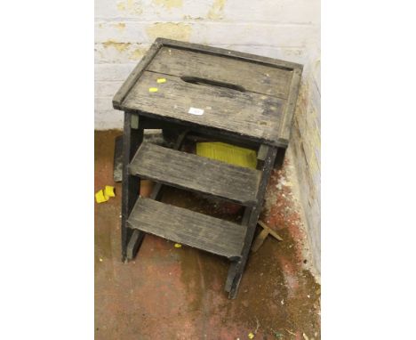 A WOODEN THREE STEP LADDER