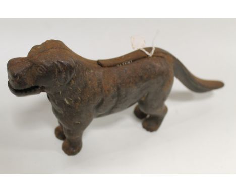 A VINTAGE CAST NUT CRACKER IN THE FORM OF A DOG 