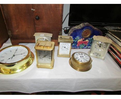 A quantity of clocks including 1930's porcelain mantel clock