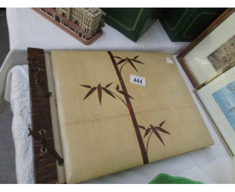 An empty vintage photo album with wood front