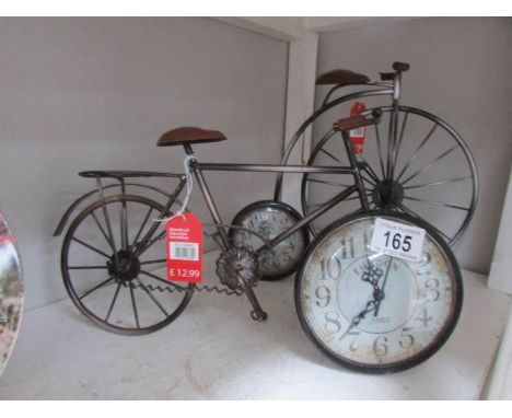 A bicycle clock and a penny farthing clock
