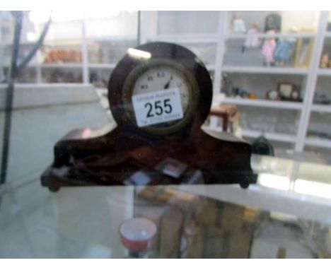 A small mahogany mantle clock