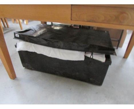A tin trunk and contents
