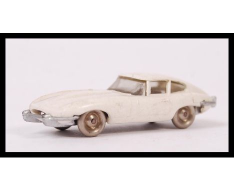 A rare vintage 1950's / 1960's Lego 1:87 scale plastic model E Type Jaguar. White, with silver base and metal wheels. All bum