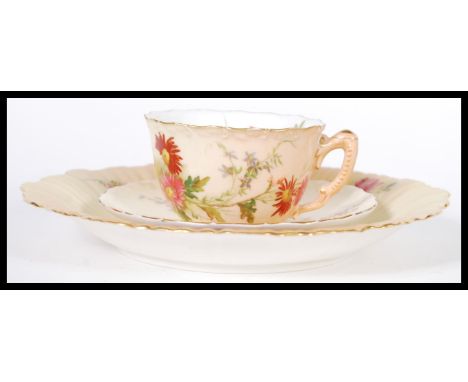 A Royal Worcester Ivory blush matched trio having chintz foliate pattern. The cup with puce mark dated 1916 with RD NO 190547