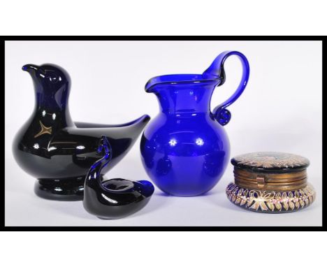 A group of blue glassware to include a signed Bristol Blue large paperweight in the form of a bird, other signed Bristol Blue