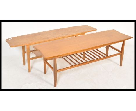 Two vintage retro 20th Century coffee tables consisting of a teak example with railed magazine tier and an oak example with t