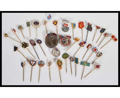 A collection of over 30 vintage 20th Century enamel badges and pins to include various Russian Eastern European examples incl