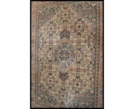 A vintage Persian natural dye deep pile wool on cotton carpet rug originally from the central region of Iran near Hamadon. De