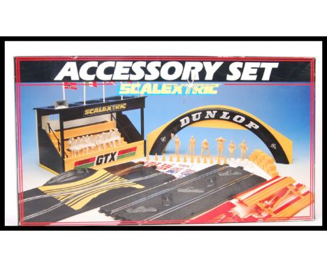 A vintage Scalextric Accessory set C221 Grandstand Dunlop figures set. Appears complete within it's original box.&nbsp;