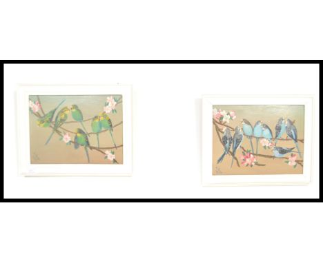 A pair of framed vintage 20th Century oil on board paintings. The paintings depicting Budgies /&nbsp;budgerigars roosting on 
