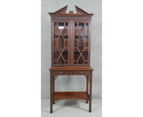 A C.1900 mahogany Chinese Chippendale style display cabinet by Edwards and Roberts with upper astragal glazed section above b