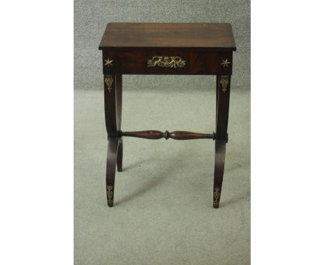 An Empire style mahogany lamp table fitted with frieze drawer and ormolu mounts on X frame supports. H.72 W.53 D.36 cm. 