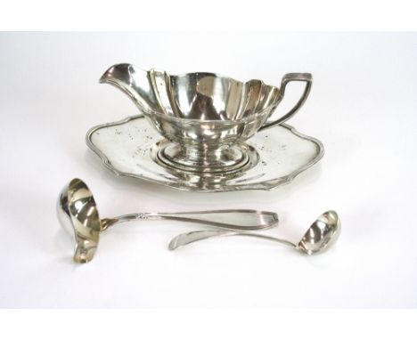 A sauce boat and stand, stamped Sterling; a sauce ladle, stamped List 90; and a small cream ladle, stamped Birks, Sterling, (