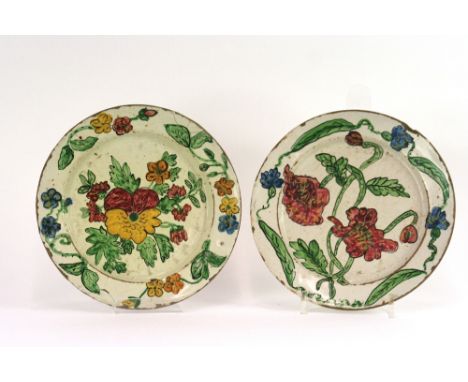 Four continental faience style plates, with brightly coloured floral enamel decoration, 20cm dia.