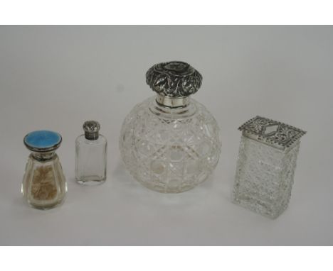 A hob nail cut glass and silver mounted globular scent bottle; a cut glass and silver mounted tidy jar; a small silver mounte