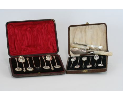 A cased set of six Victorian silver Apostle handed teaspoons; and matching sugar tongs, Birmingham 1888; a set of six silver 