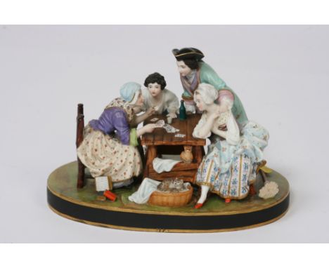 A 19th Century French porcelain figure group, by Gille Jeune, depicting figures playing cards with attendant owl, cat and kit