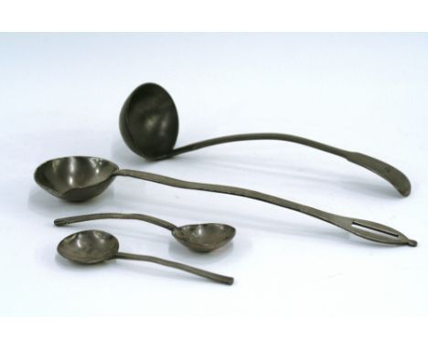 A pewter side pouring ladle, the flat handle with hanging slot; a 19th Century "Fiddle" patterned soup ladle; a slip top spoo