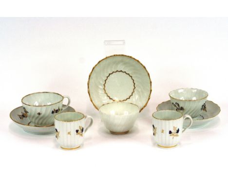 An early 19th Century English porcelain tea bowl and saucer, with floral spray decoration, heightened in gilt; two similar te